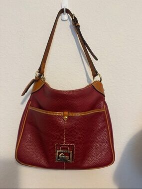Dooney & Bourke Burgundy Pebbled Leather Shoulder Bag with Tan Trim